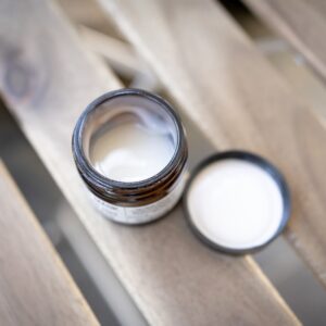 silver ring on brown wooden table